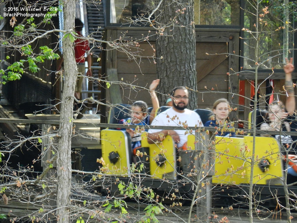 Grizzly's yellow train pulling away from the station.