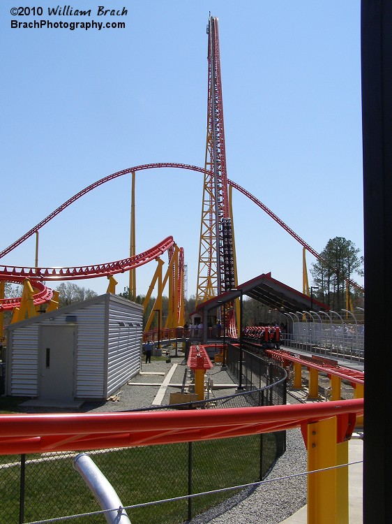 One of the two trains on Intimidator 305 getting pulled up the lift hill.