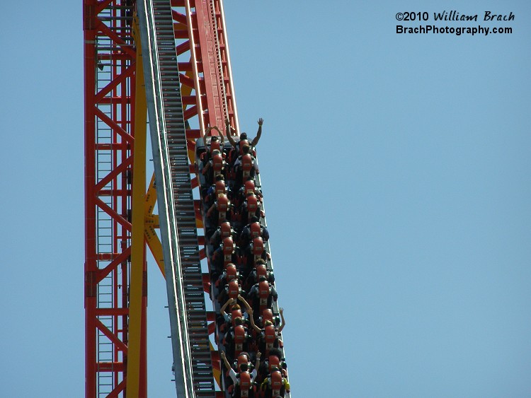 Red train getting pulled up the lift hill.  Intimidator 305 uses the exact same system that Millennium Force uses - an elevator cable lift hill system.  The I-305 lift is at a 45-degree angle and you get pulled up very quickly.