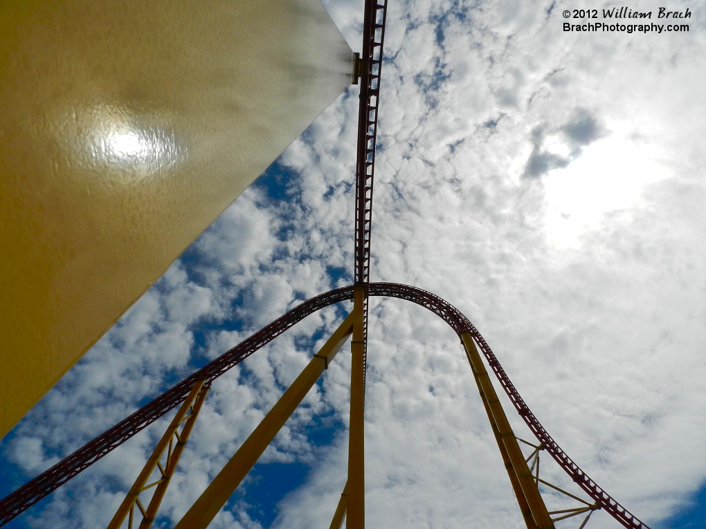 Looking straight up at the second hill passing under the lift hill and drop.