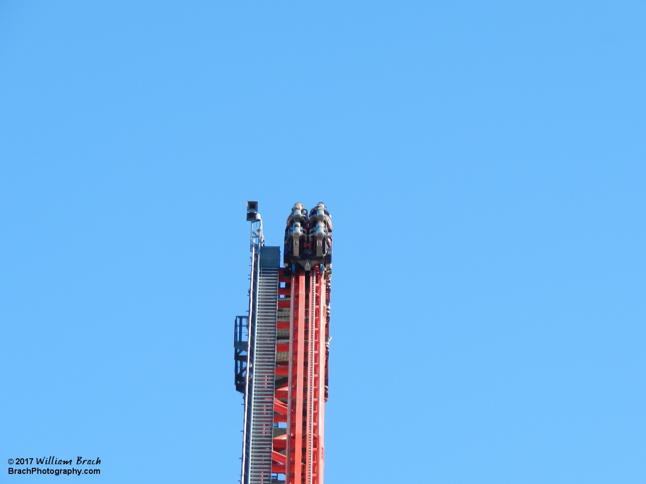 Silver train cresting the lift hill.