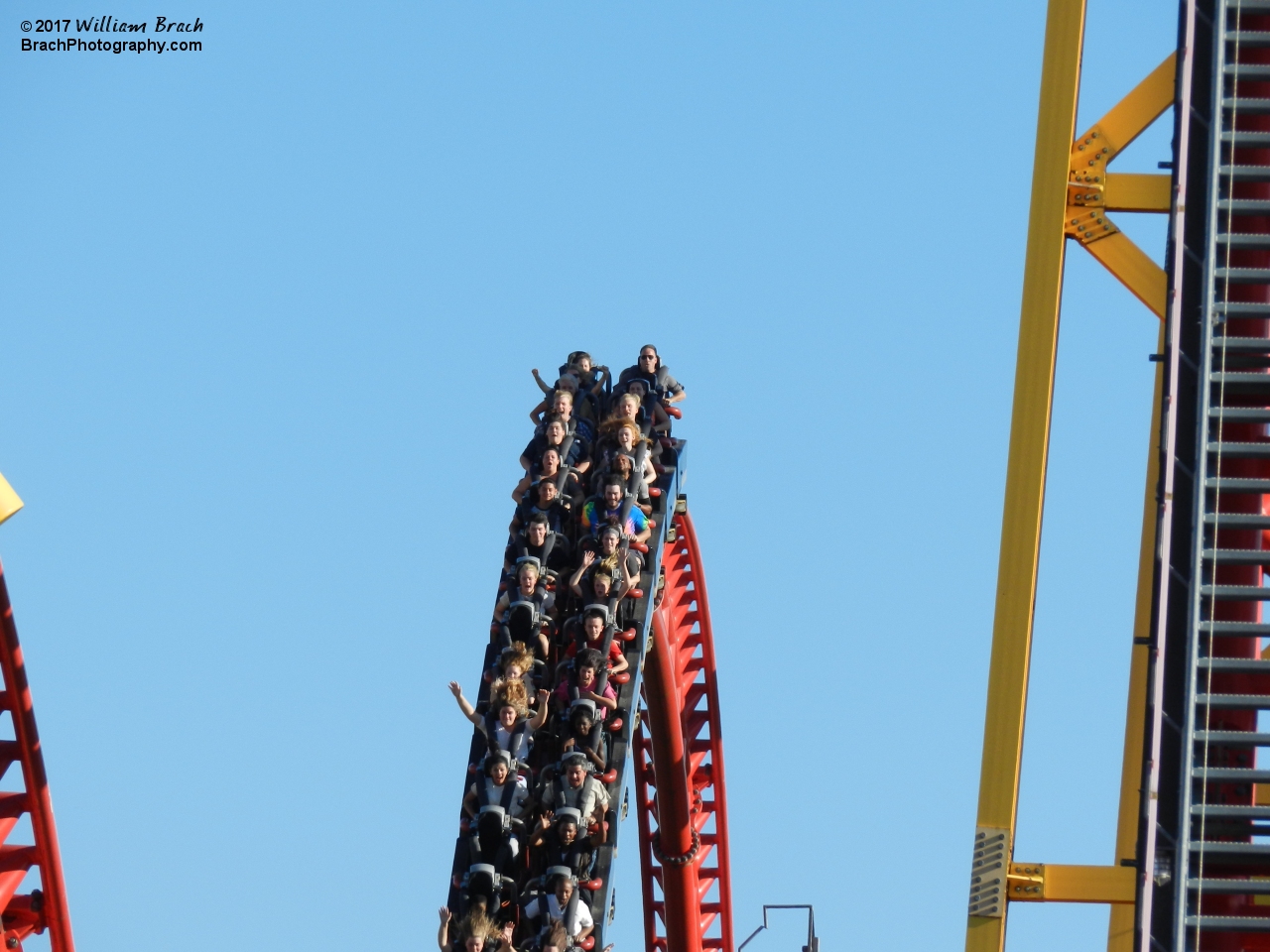 Another train full of happy riders going over the third hill.