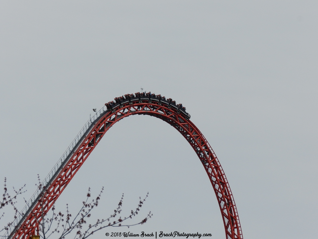 Intimidator 305's red train cresting the top of the lift hill.