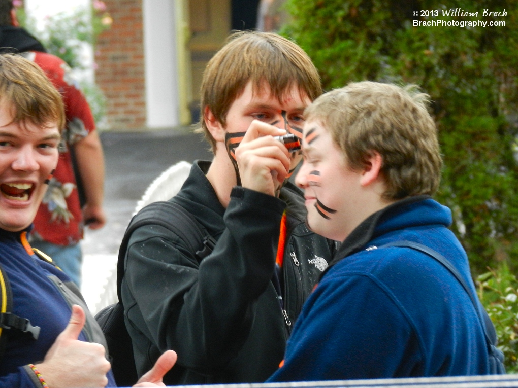 Gavin getting painted by Michael before the start of the Coaster Rally.  Logan approved of the paint job!