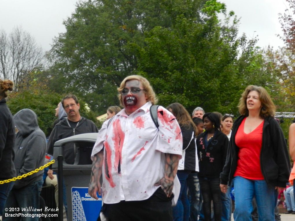 Haunt monster walking towards his post inside Club Blood before the maze opens to the public for the night.