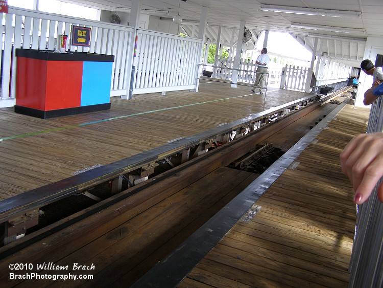 South side blue train is in the brake run about to enter the station.