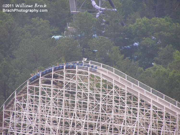 Rebel Yell's blue train starting its run from the lift hill.