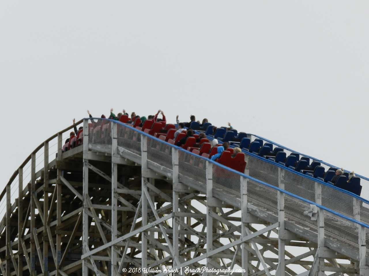 Racer 75 trains about to crest the top of the lift hill.