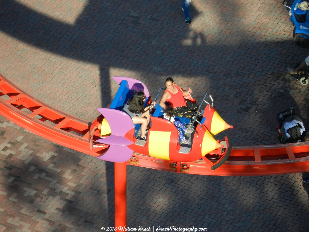 Another family takng a trip on the Rocket Express ride.