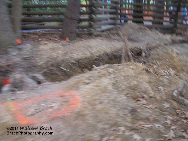 A rather blurry photo (taken while Laura was driving the Tollway) of trenches made for the electrical wiring for the Starlight show.  Opens in June!