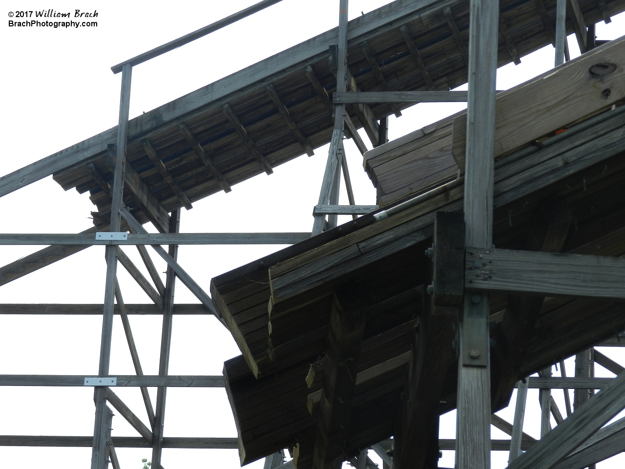 Lift hill in the background and first drop in the foreground.