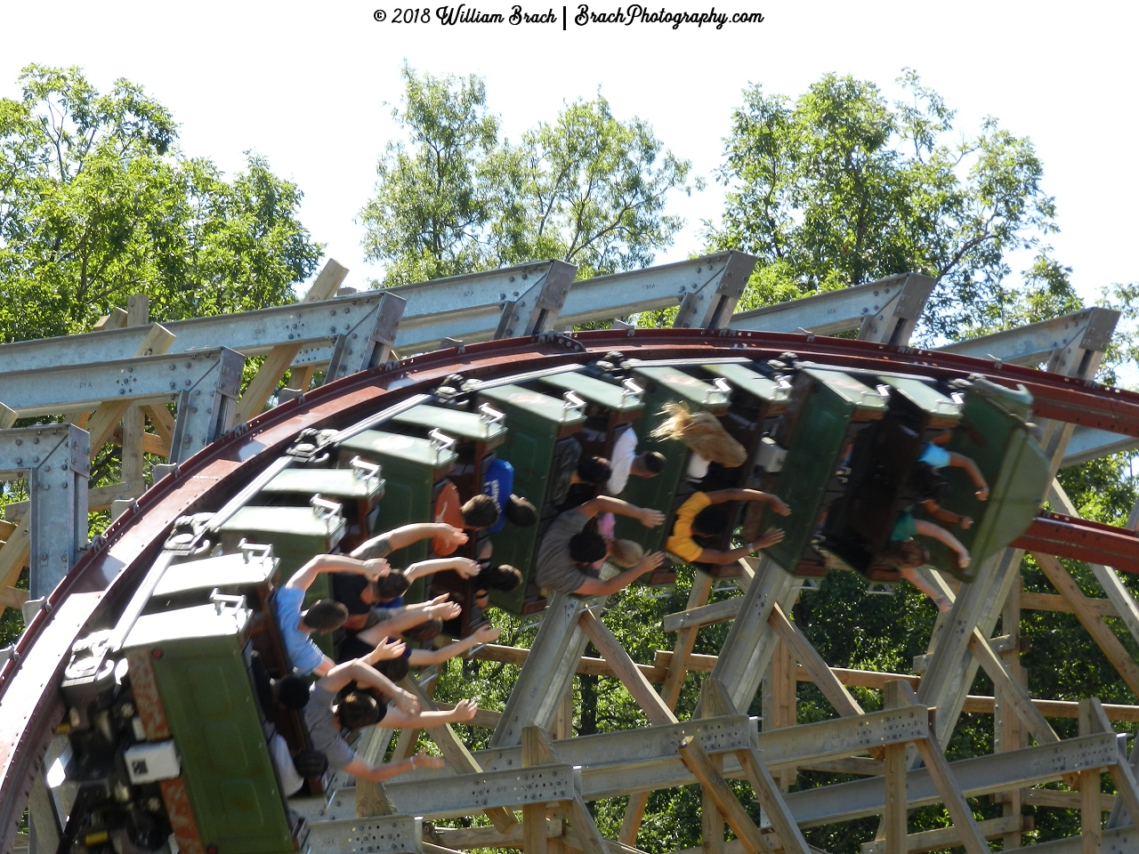 Green train going through the first turn after the drop.