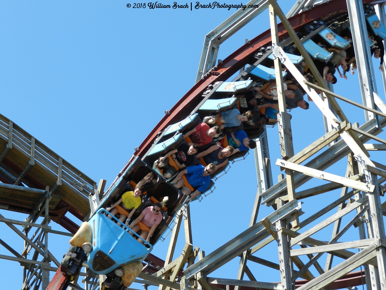 Another look at the first drop on Twisted Timbers with the blue train going through it.