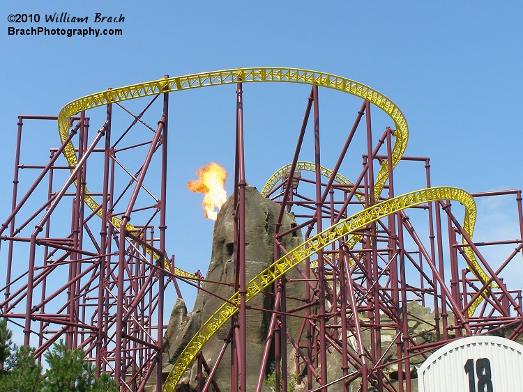 Volcano spurts out some fire before launching a train.