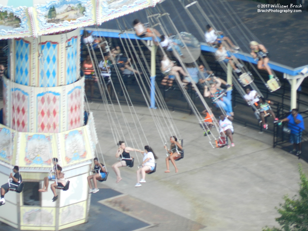 Riders enjoying their ride on the Wave Swinger.