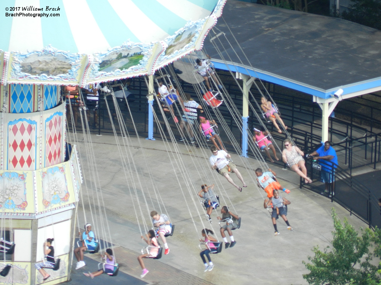 Riders enjoying their ride on the Wave Swinger.