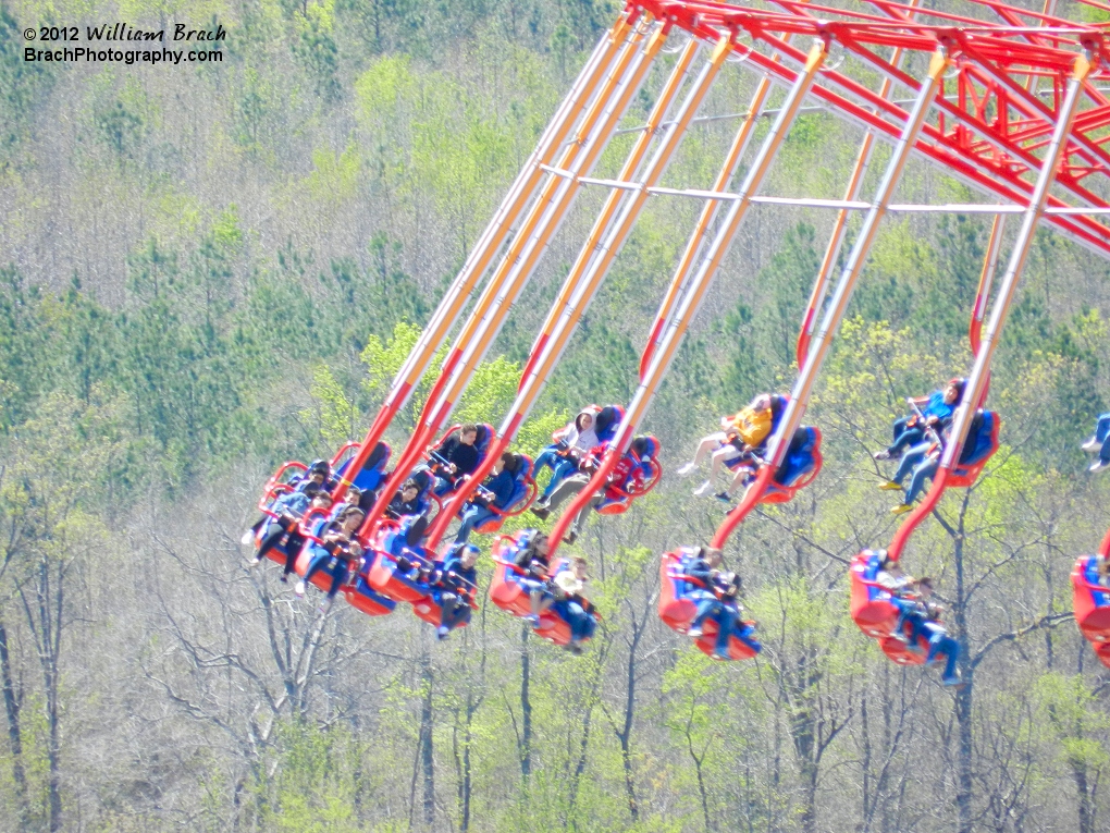 Taking a look at the riders on WindSeeker up in the air from the Eiffel Tower.