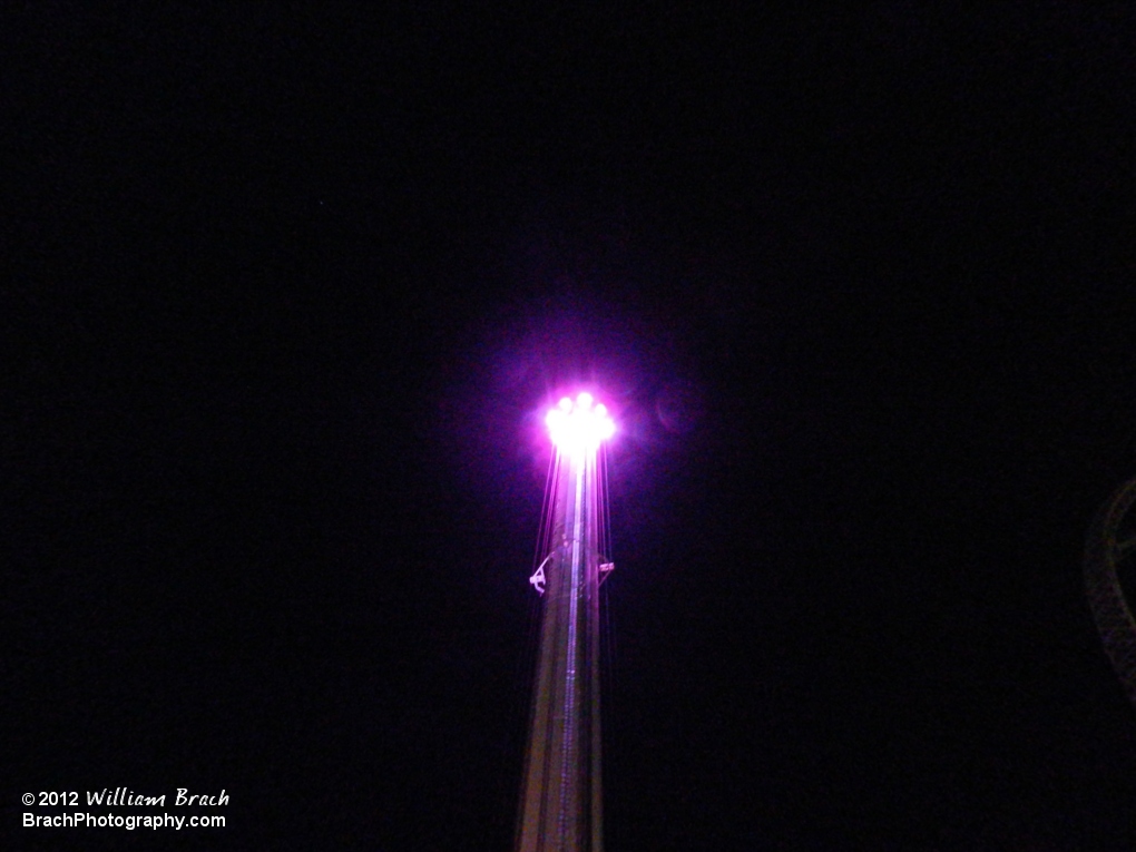 Looking up at the tower's LED lights at the top of the ride.