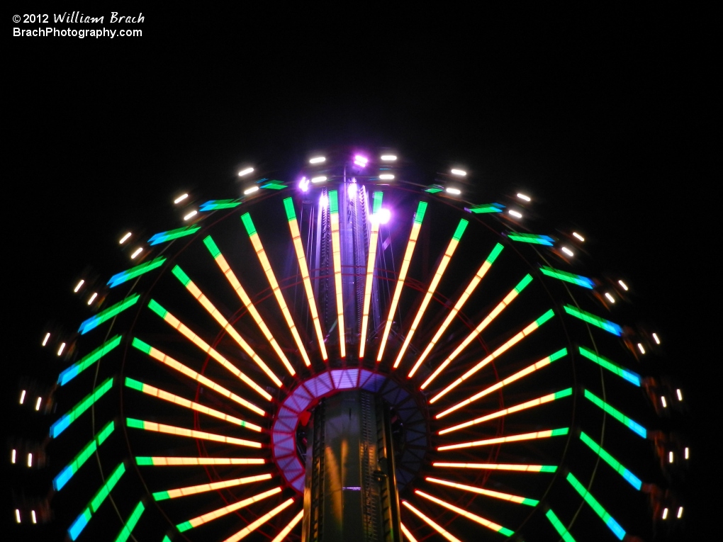 Yellow, green and blue lights on WindSeeker at night.