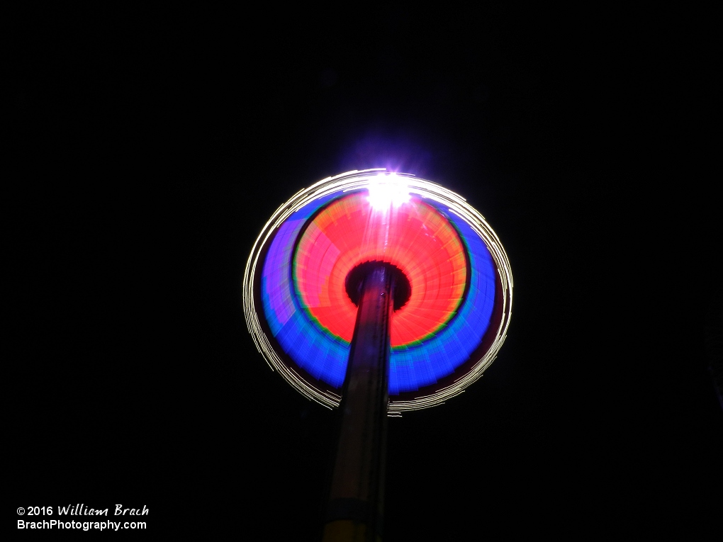 Looking up at the WindSeeker gondola going up the tower.