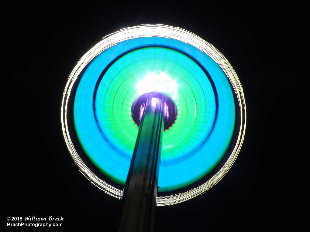 WindSeeker starting to lower itself from the top of the tower at night.