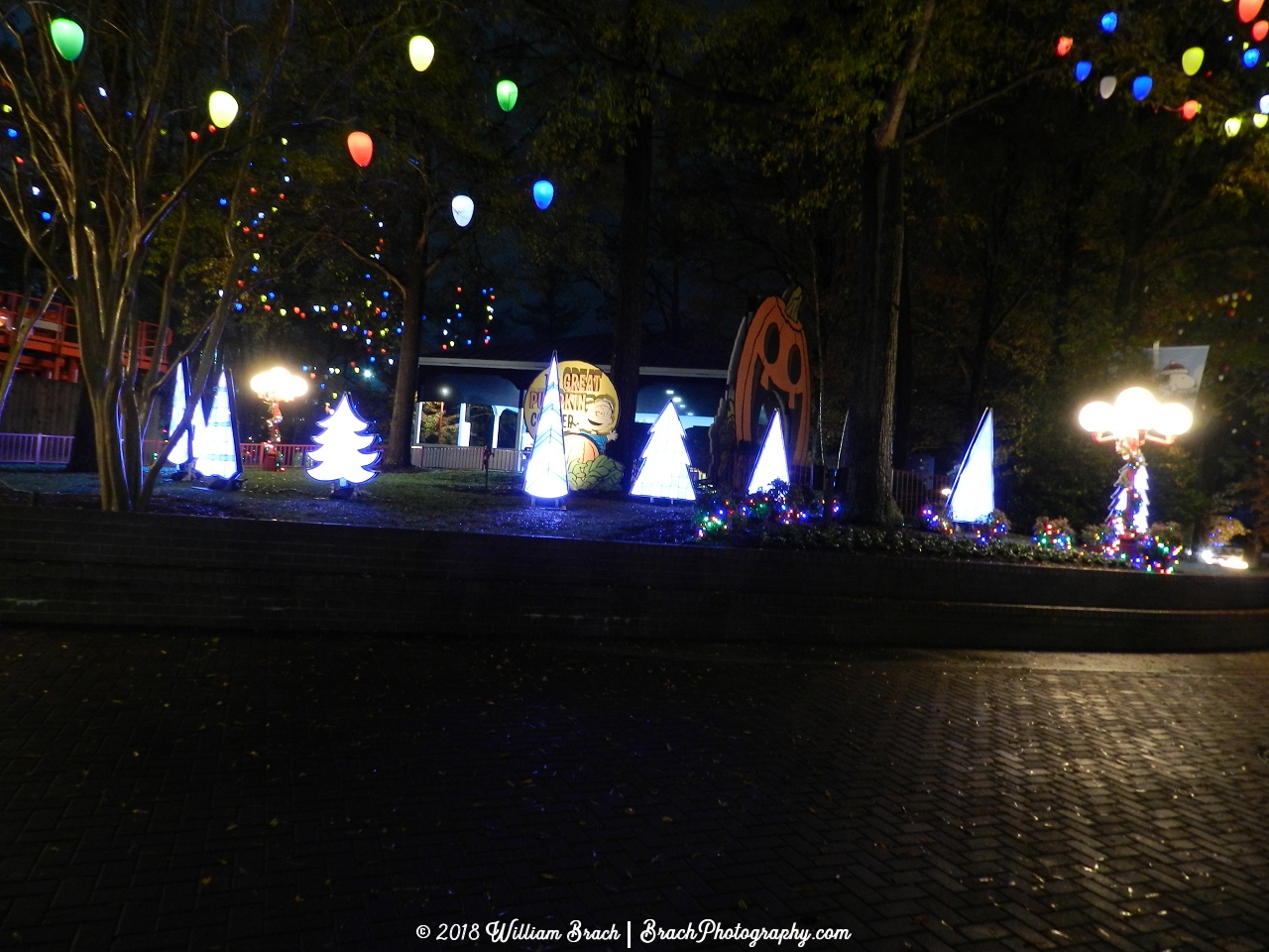 Planet Snoopy all lit up with decorations that are very familiar to the Charlie Brown Christmas Special.