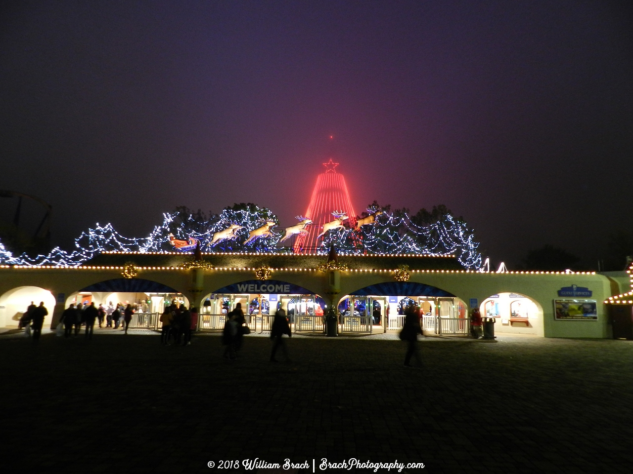 Outsid ethe entrance to the park, you see Santa and his reindeer at the front entrance!