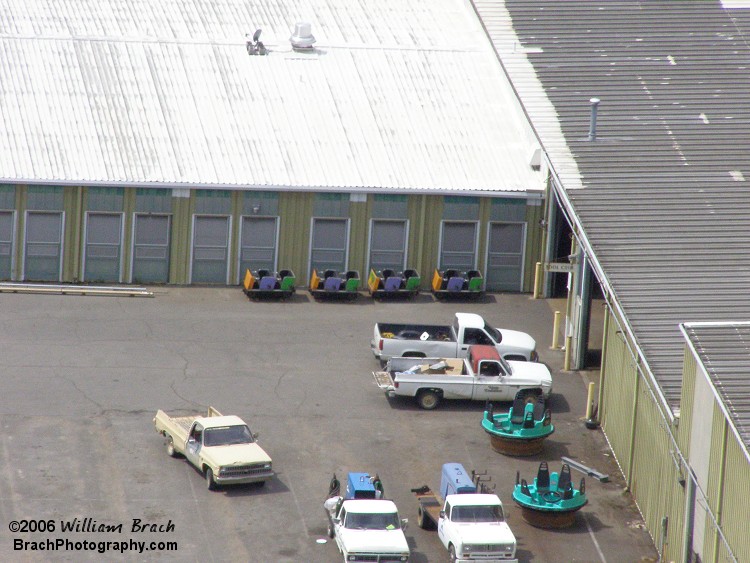 Ghoster Coaster cars sitting ouitside the maintenance building.