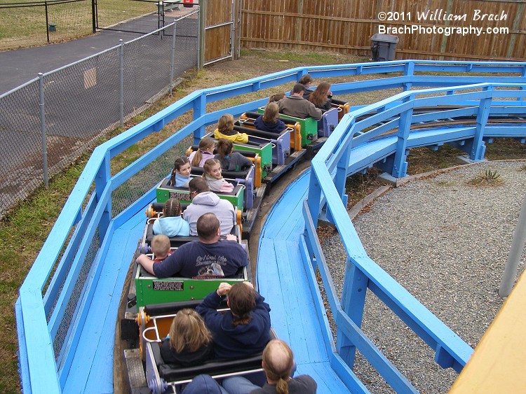 Ghoster Coaster train rolling towards the lift hill.