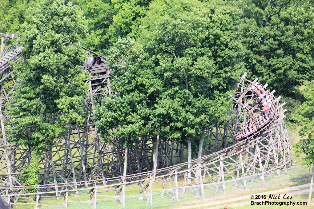 A train rounding hte curve to head into the drop.