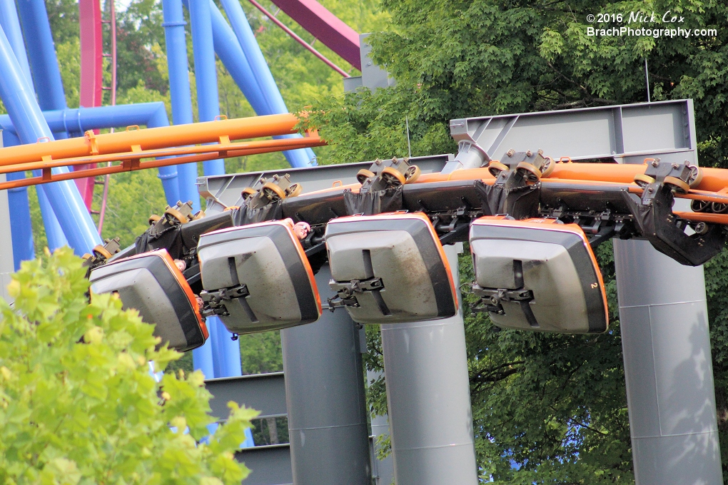 A train rounding an overbanked curve.