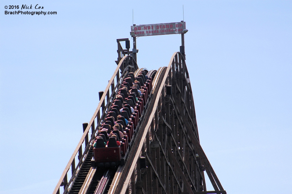 The train cresting the top of the hill.