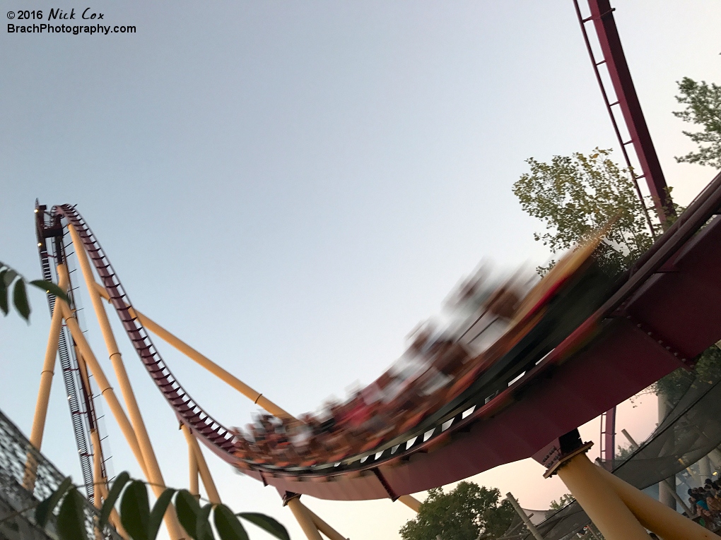 Diamondback speeding down its first drop at dusk.