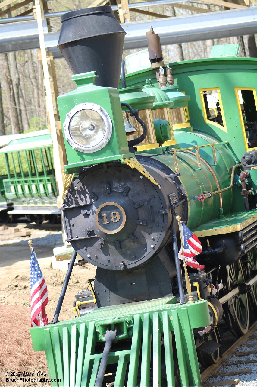 The train rolling into the station.