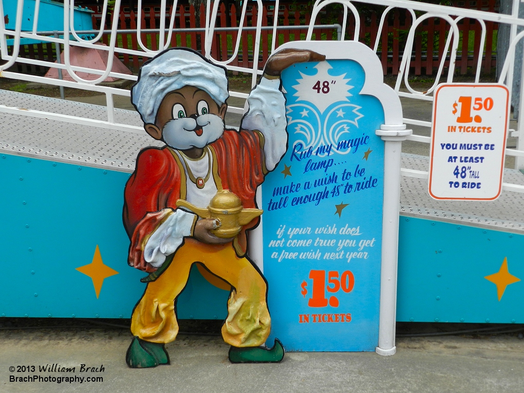 Knoebels has some really good height check boards for your kids to check their height.  Here, you have to be as tall as Kosmo's hand to ride.