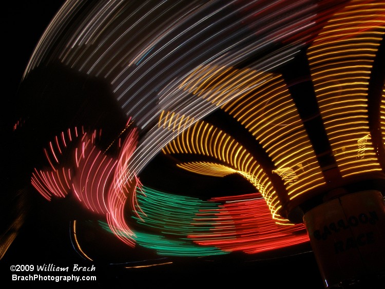 Beautiful photo of the Balloon Race in motion at night.