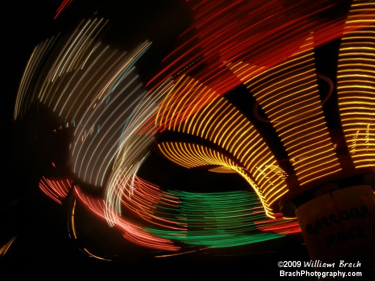 Another nice shot of the Balloon Race in motion at night time.