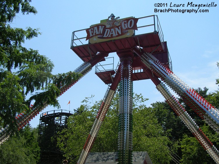 Looking up at the ride's sign.