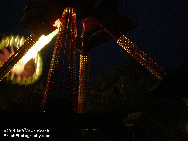 Ride is in motion at night.