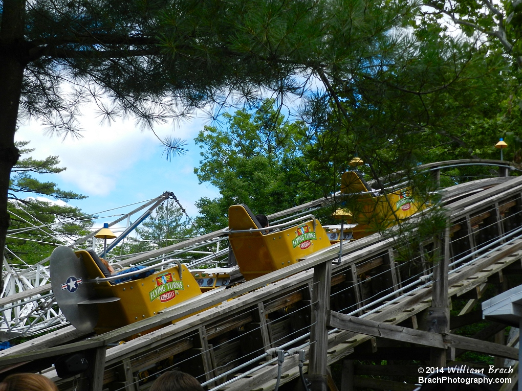 The yellow train going up the lift hill.