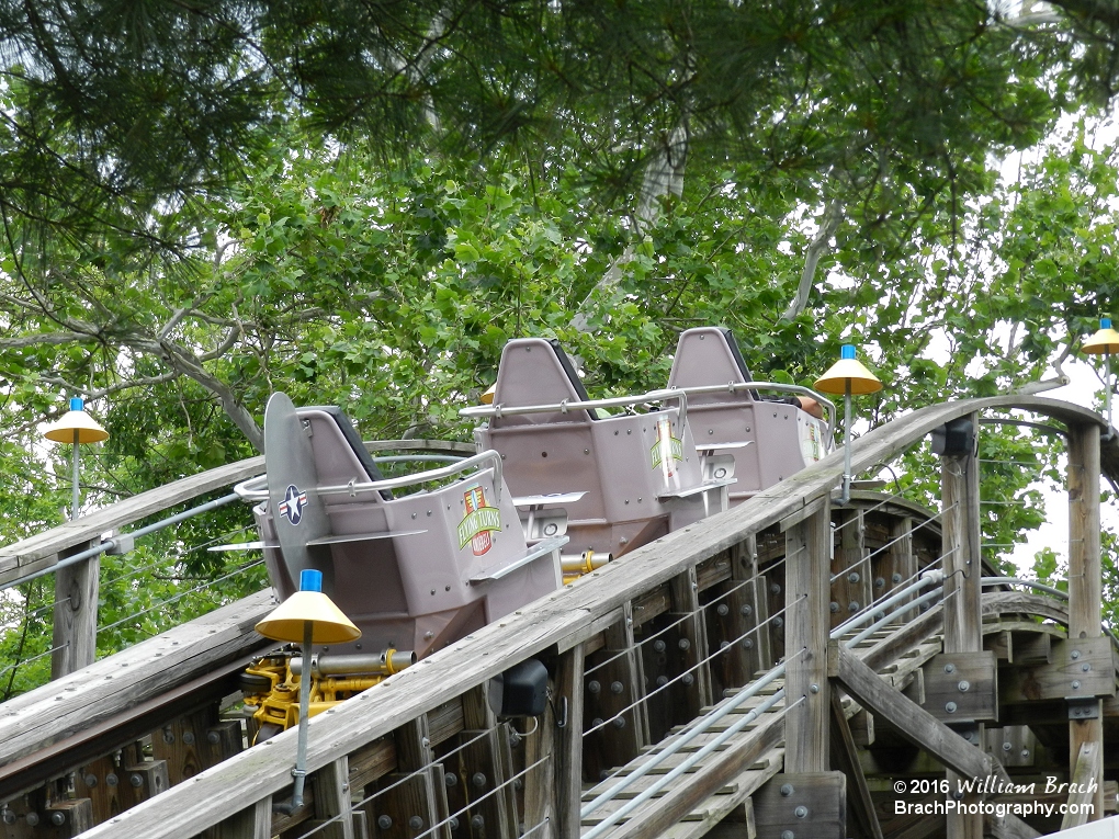 Purple train going up the lift hill.