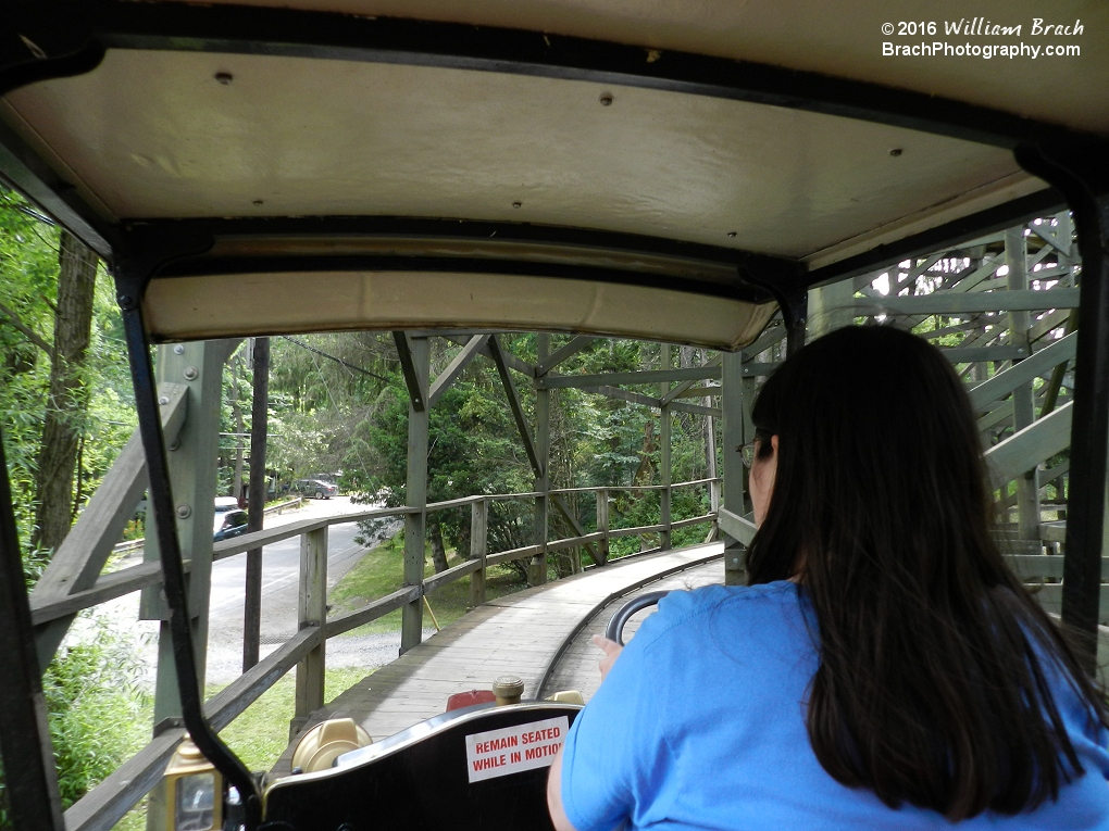 Passing under the structure of Phoenix on Gasoline Alley while Laura drives.