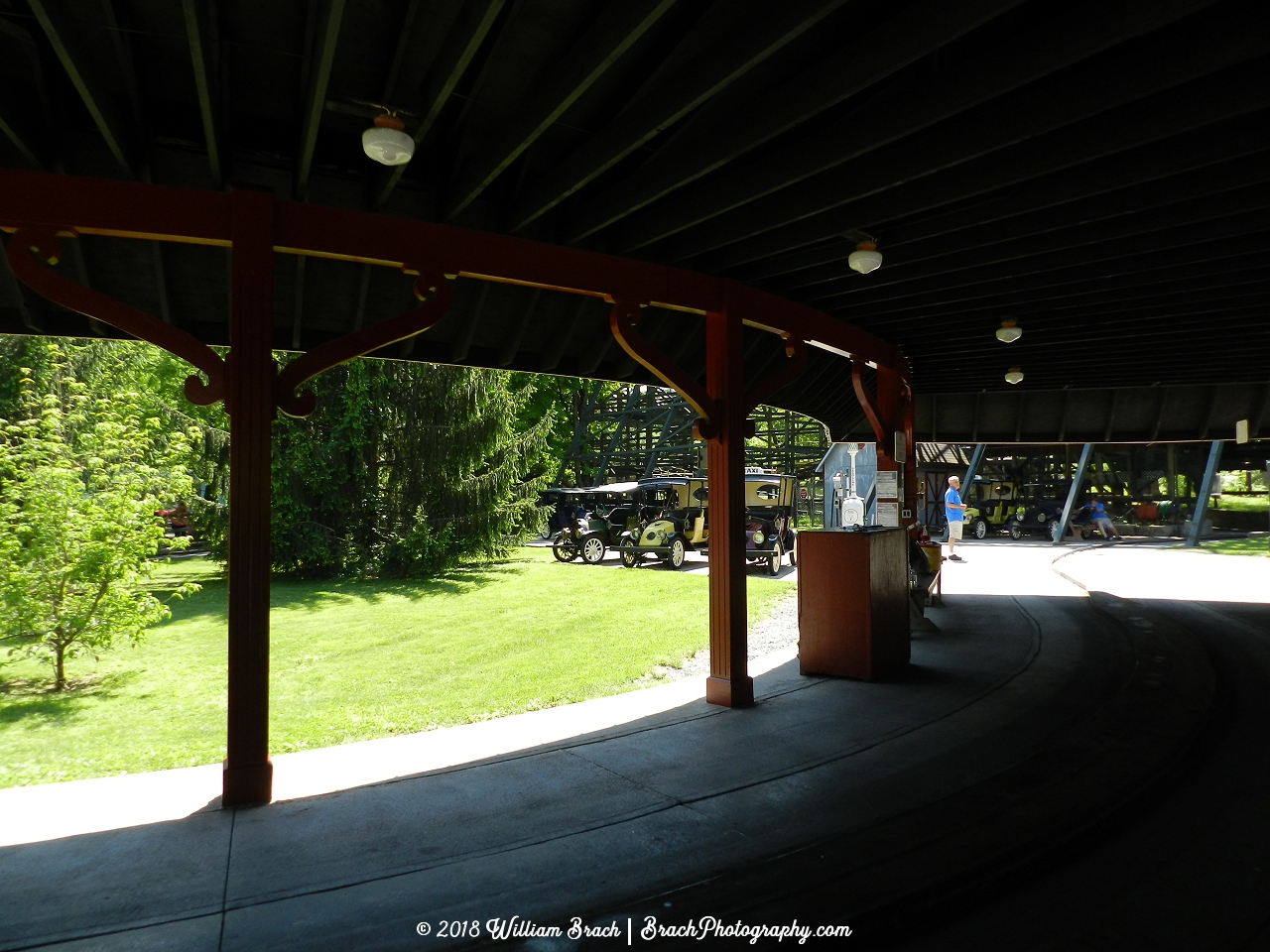 View of the station with several cars waiting to be put on the track.