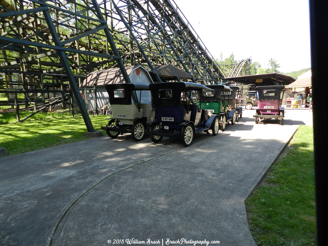 Spare Gasoline Alley cars waiting to be put on the track.