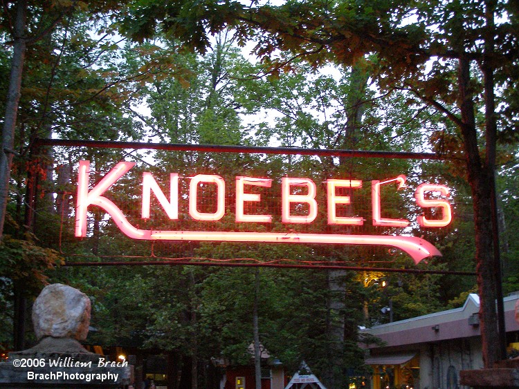 Park sign lit up at dusk.