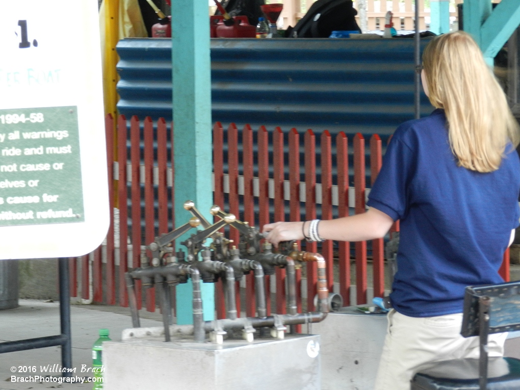 Ride Operator working the controls for the Motor Boats.