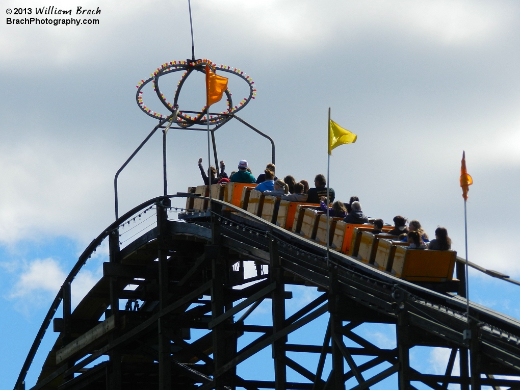 Yellow train climbing the lift hill on Phoenix.