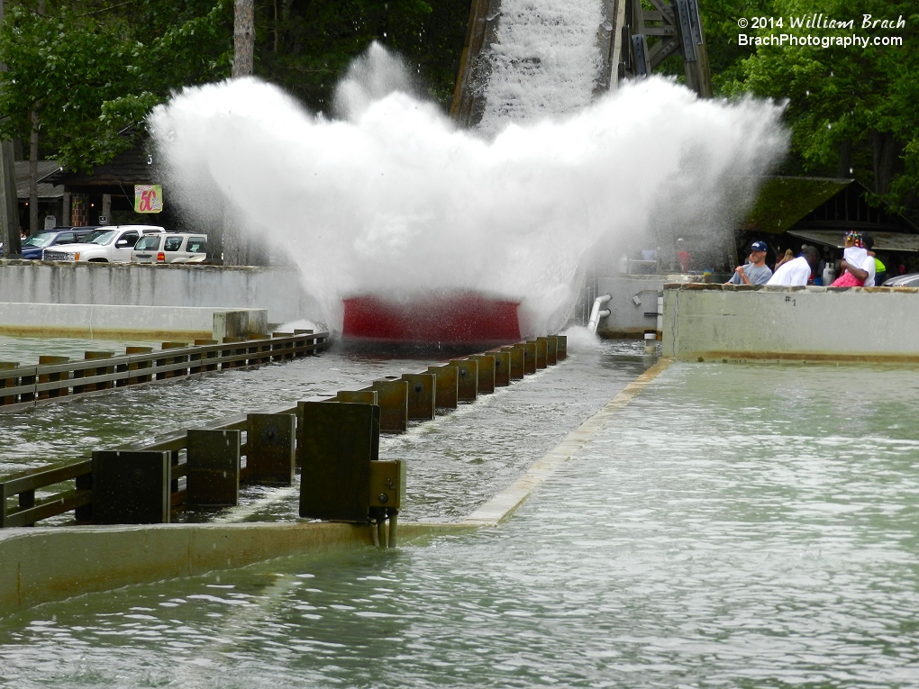 Skloosh boat making a huge splash as it hits the splash pool.