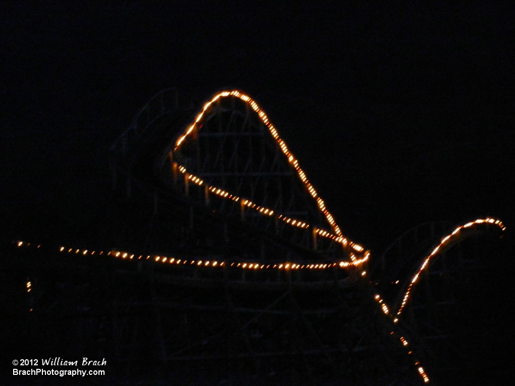 Twister lift hill lights at night.