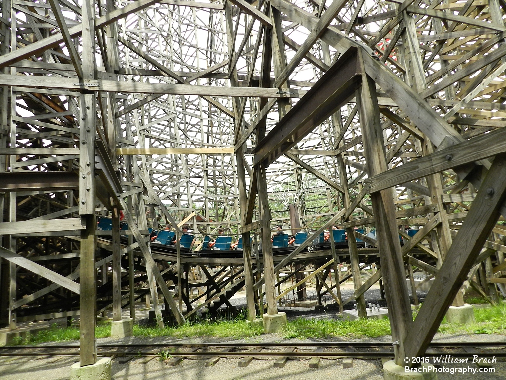 Blue train on Twister starts up the first lift hill as I'm passing through while riding the Pioneer Train.